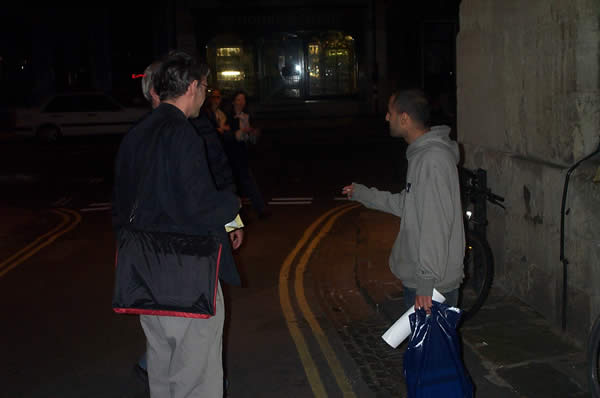 2 philosophers tracked down in a dark Oxford alley, presented with their copies of "Harry Potter and ...", and engaged in debate on the ethics of the Philosophy of Physics